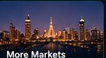 City skyline at night labelled more markets